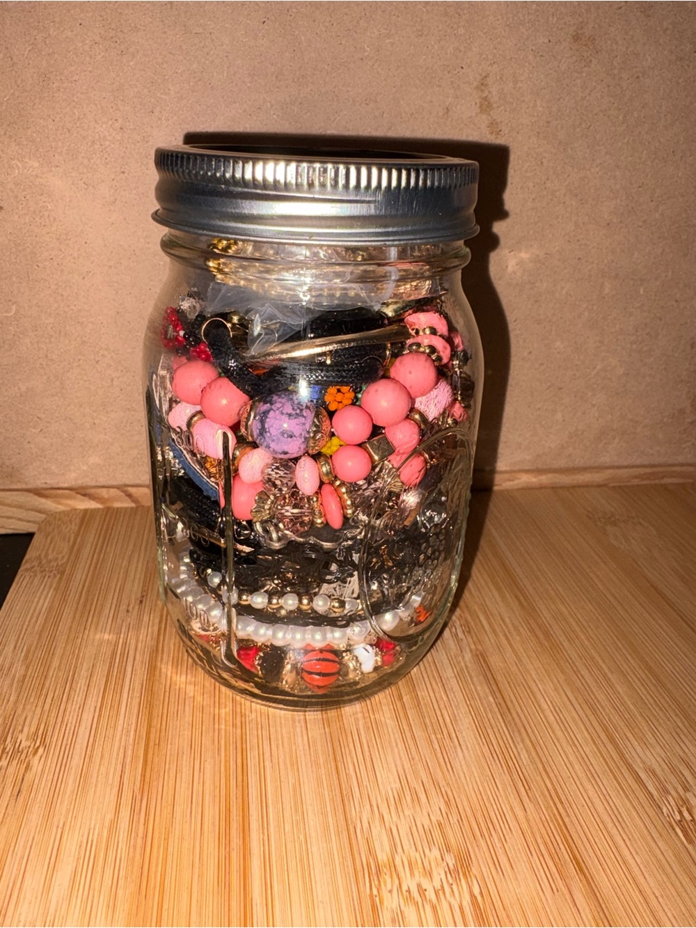 Mason Jar filled with different types of jewelry